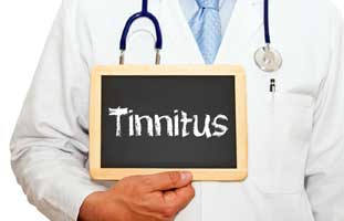 Doctor in lab coat holding chalkboard with word Tinnitus